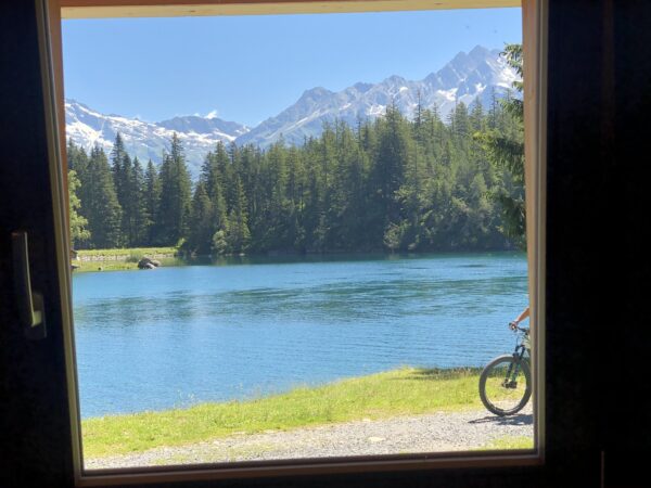 Alpensee mit Rad-Motiv - Wandbild aus Göschene